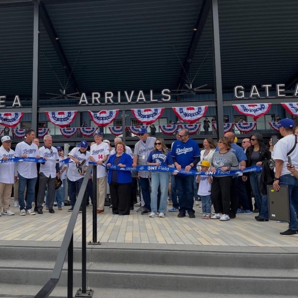 Community leaders and fans gather for the ribbon cutting ceremony at ONT Field outside the arrivals entrance.