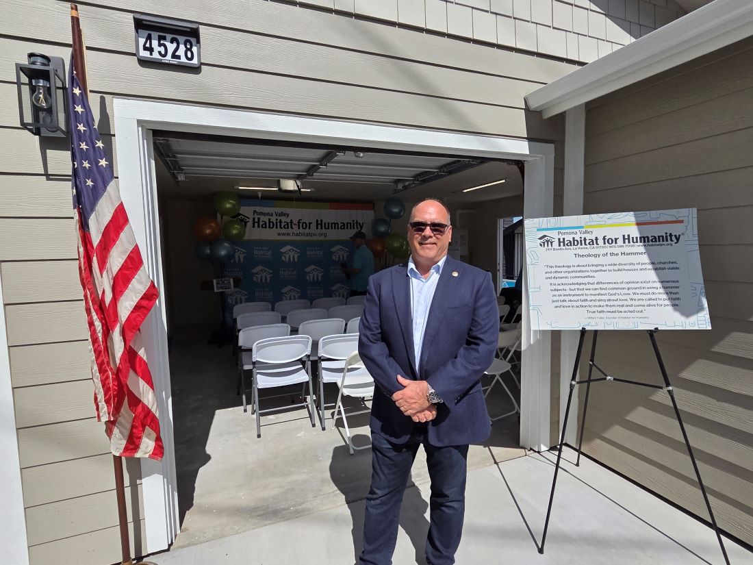 Supervisor Curt Hagman stands outside Habitat for Humanity home before dedication ceremony.