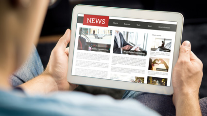 Computer tablet showing news