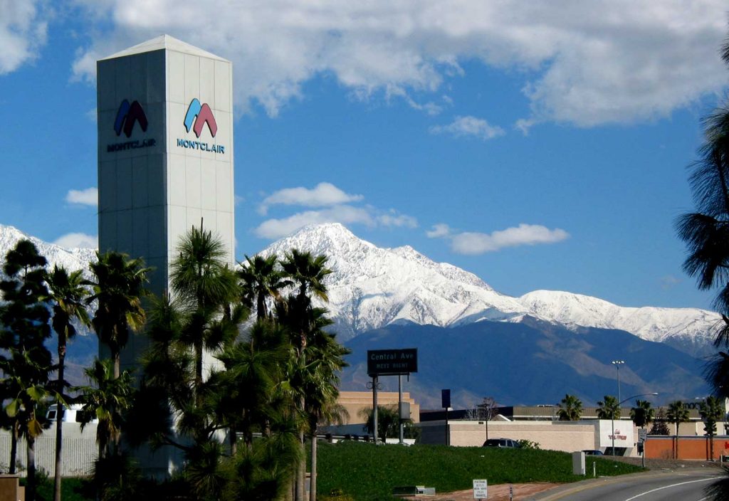 Montclair sign with view of snowy mountains
