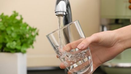 Filling up a glass of water from a faucet