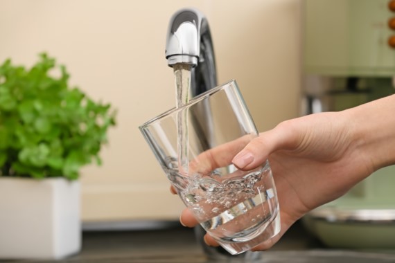Filling up a glass of water from a faucet