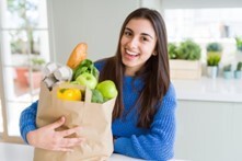 Woman holding a bag of groceries