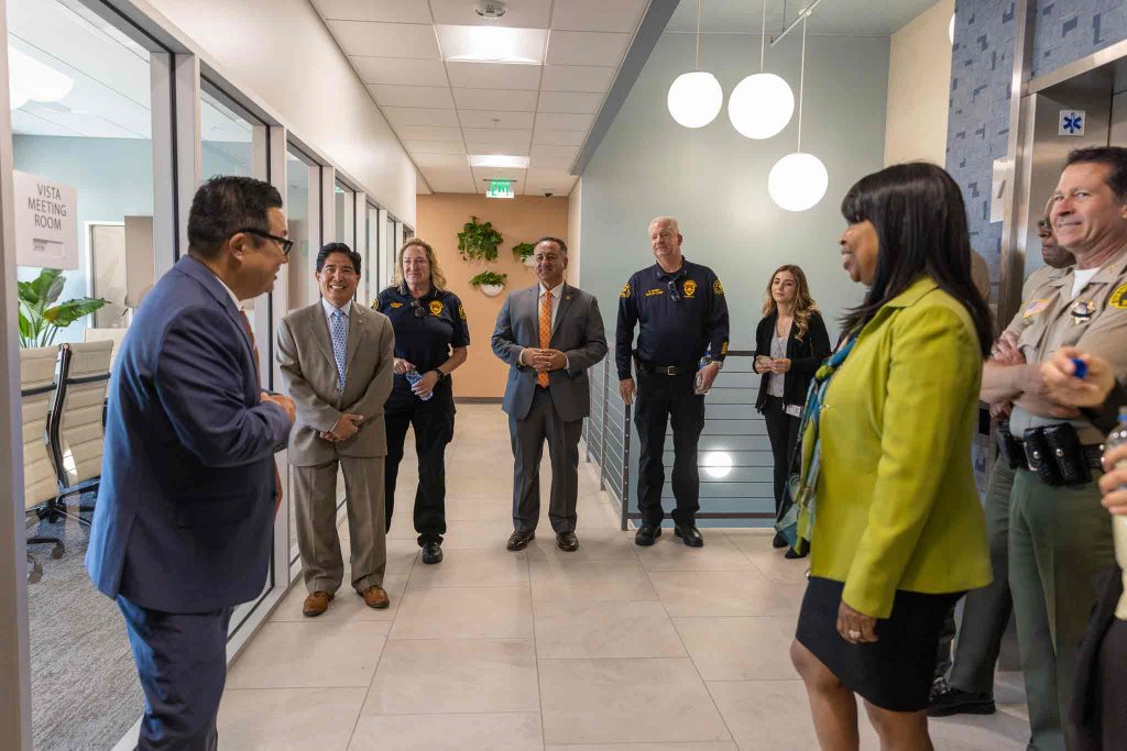 County Leadership Team standing in the lobby of the new Public Defenders building