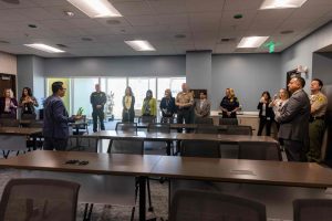 County Leadership Team touring the conference room of the new Public Defenders building.