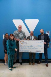 Supervisor Hagman presenting large check to the Chino Valley YMCA.