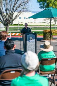 Supervisor Hagman standing at the podium speaking about the importance of Arbor Day.