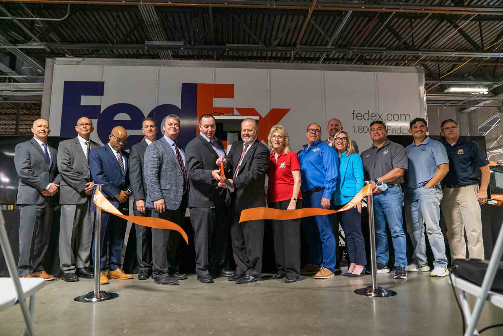 FedEx Leadership and Local Elected Officials cut the ribbon to commemorate the grand opening of the new Chino FedEx facility.