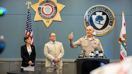 Sheriff Shannon Dicus speaking at Chino Hills PD Press Conference with Congresswoman Young Kim and Supervisor Curt Hagman in the background.