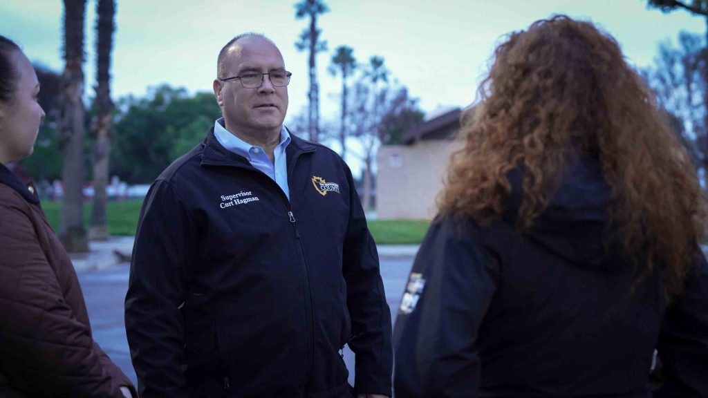 Fourth District Chief of Staff Katherine Kolcheva, Supervisor Curt Hagman and Director of Community Development and Housing Agency Carrie Harmon conversing at a park in the Fourth District.