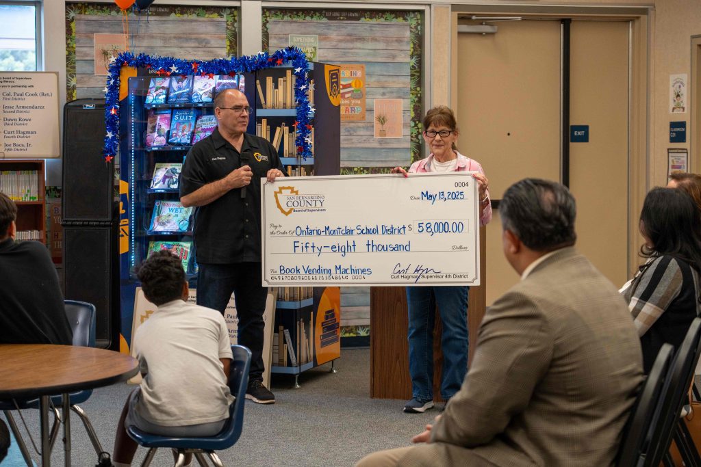 Supervisor Curt Hagman presents $58,000 check to OMSD for book vending machines.