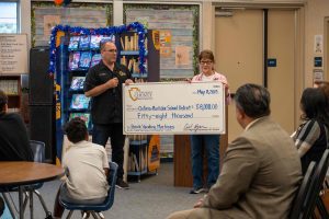 Supervisor Curt Hagman presents $58,000 check to OMSD for book vending machines.