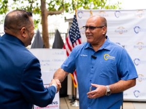 Supervisor Curt Hagman shakes hands with a representative during a Veterans Legal Institute funding presentation.