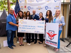 Supervisor Curt Hagman presents a $100,000 check to the Veterans Legal Institute and supporters.