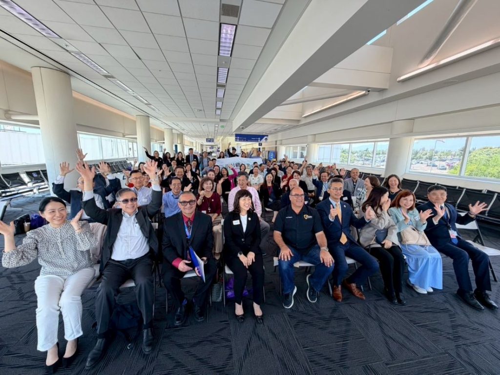 Attendees gather for a group photo during the Global Business Connect Symposium at Ontario International Airport.