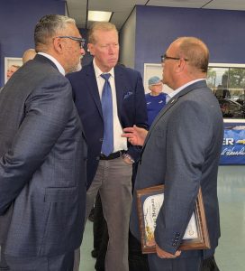 Supervisor Hagman speaks with attendees during a grand opening event at Orel Hershiser Chevrolet.