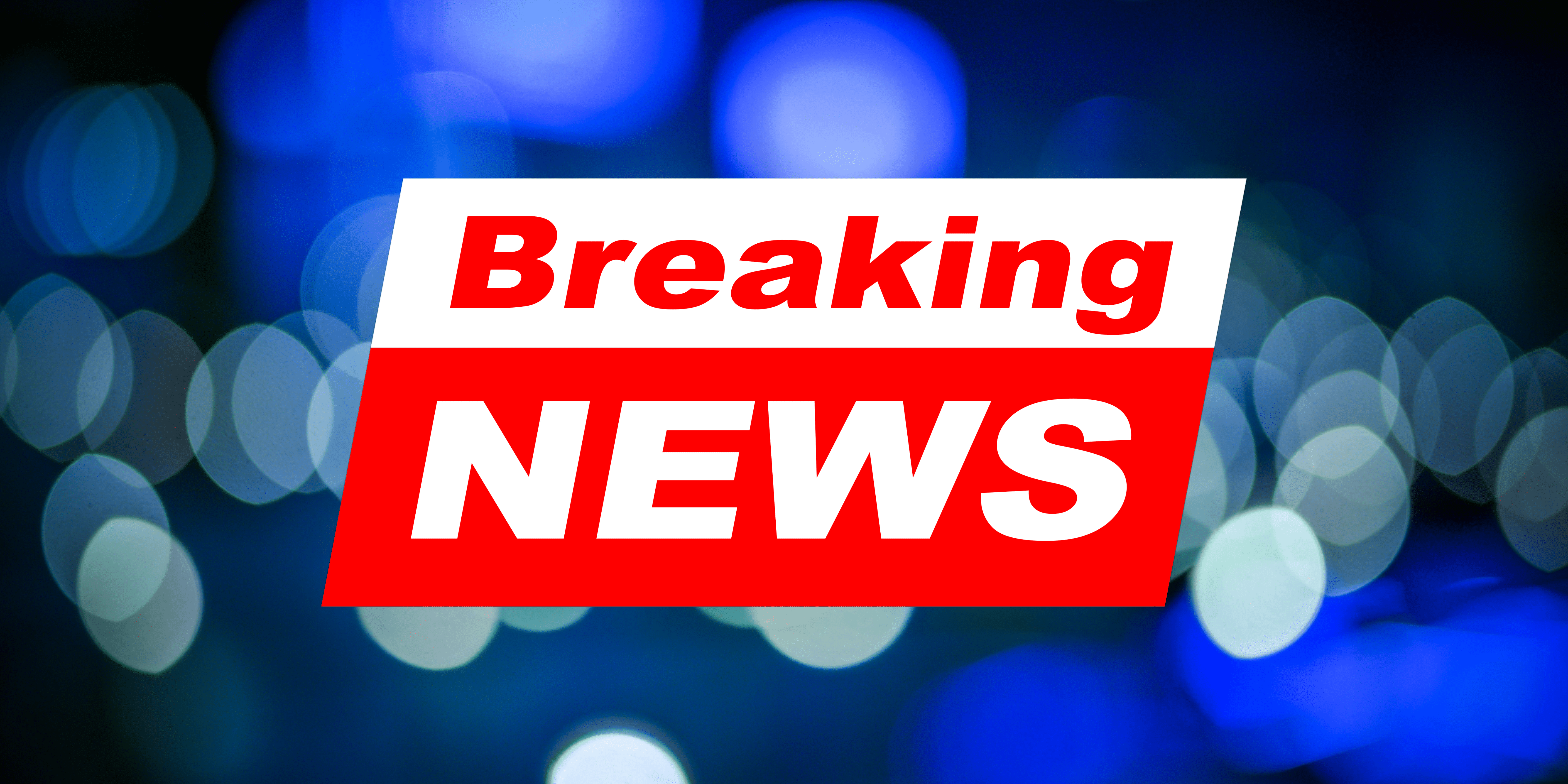 Breaking News infront of a blue background with white circles