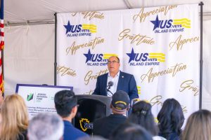 Supervisor Curt Hagman speaks at a podium during U.S. Vets Inland Empire groundbreaking event.