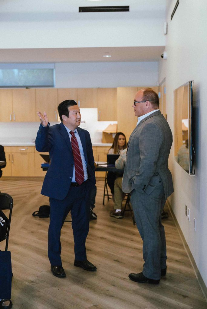 Supervisor Curt Hagman talks with Public Defender Thomas Sone at the 2022 West End Job Fair.