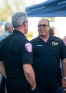 Supervisor Curt Hagman speaks with a Chino Valley firefighter during the Summer Open House.