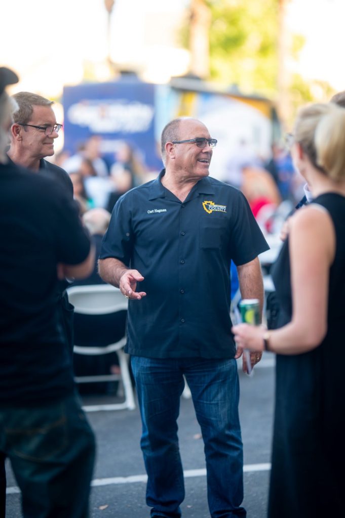 Supervisor Hagman visits with attendees and community partners at the Summer Open House.