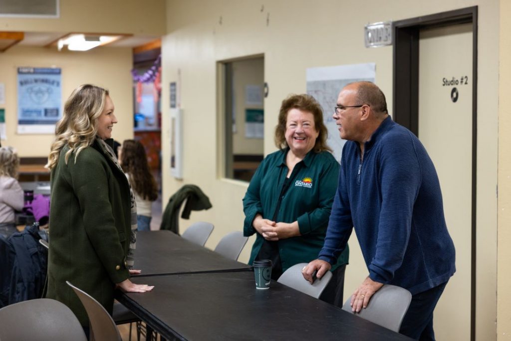 Supervisor Curt Hagman speaks with Councilwoman Debra Porada and Katherine Kolcheva inside a local facility.