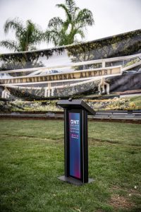 Podium set up in front of Ontario International Airport monument display.