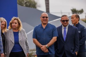 Supervisor Curt Hagman stands with local and airport leaders during the ONT new monument unveiling.