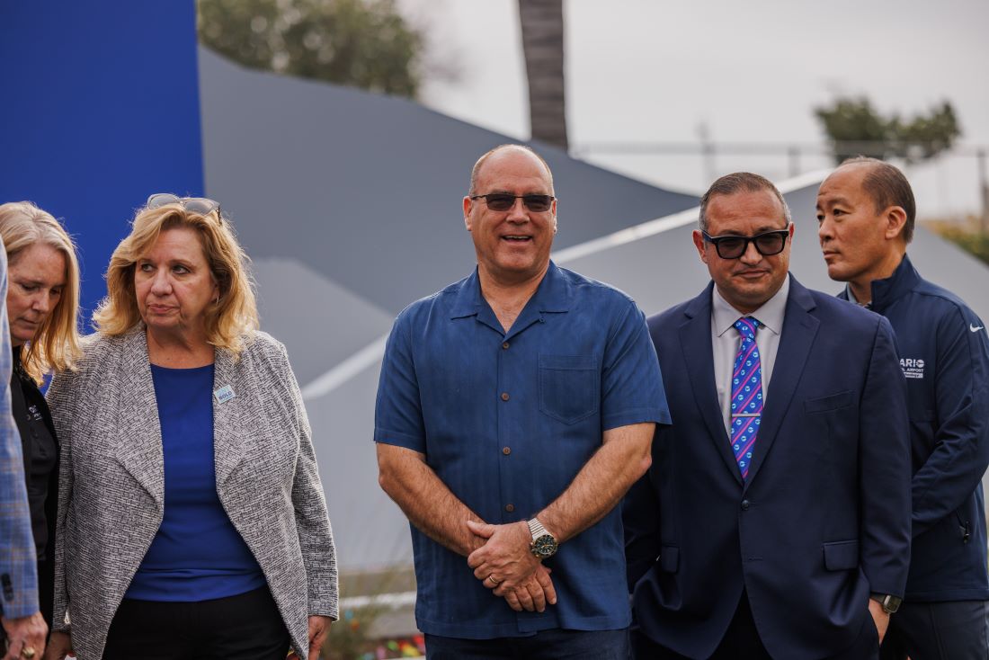 Supervisor Curt Hagman stands with local and airport leaders during the ONT new monument unveiling.