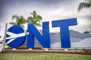 Large ONT monument sign marks the entrance to Ontario International Airport.