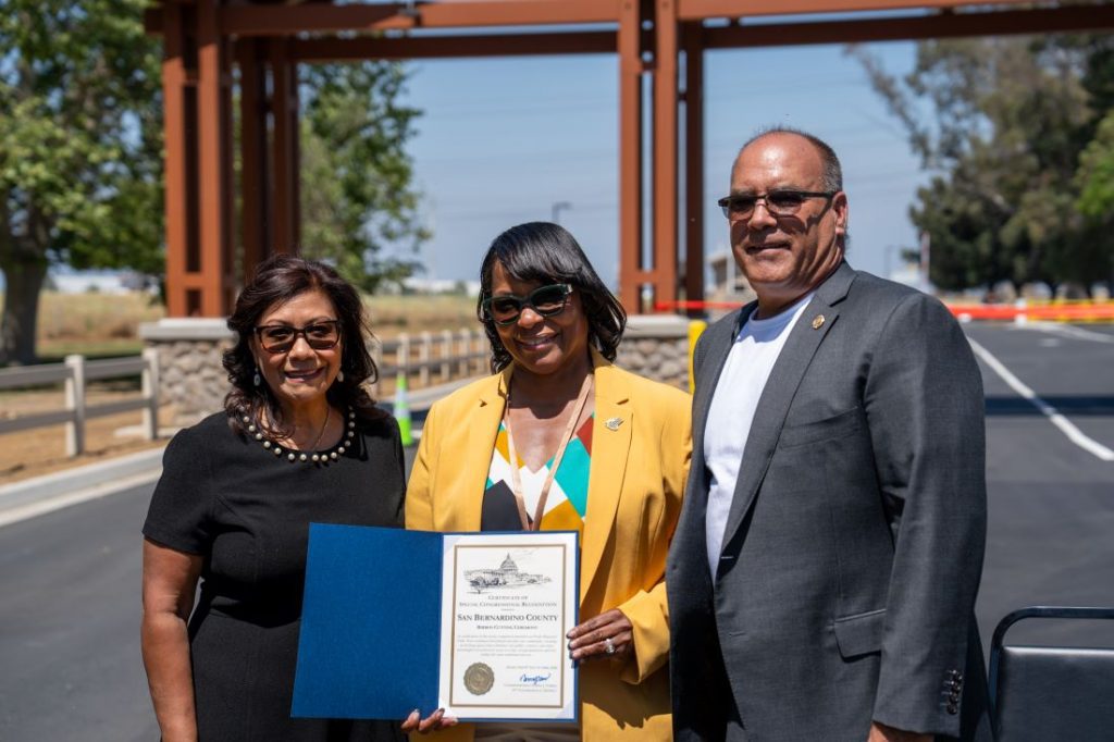Community leaders presenting a certificate of recognition during the Prado Regional Park gatehouse ribbon-cutting ceremony.