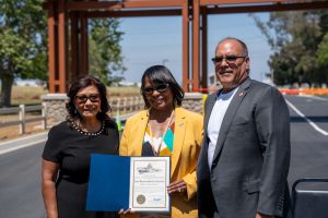 Community leaders presenting a certificate of recognition during the Prado Regional Park gatehouse ribbon-cutting ceremony.