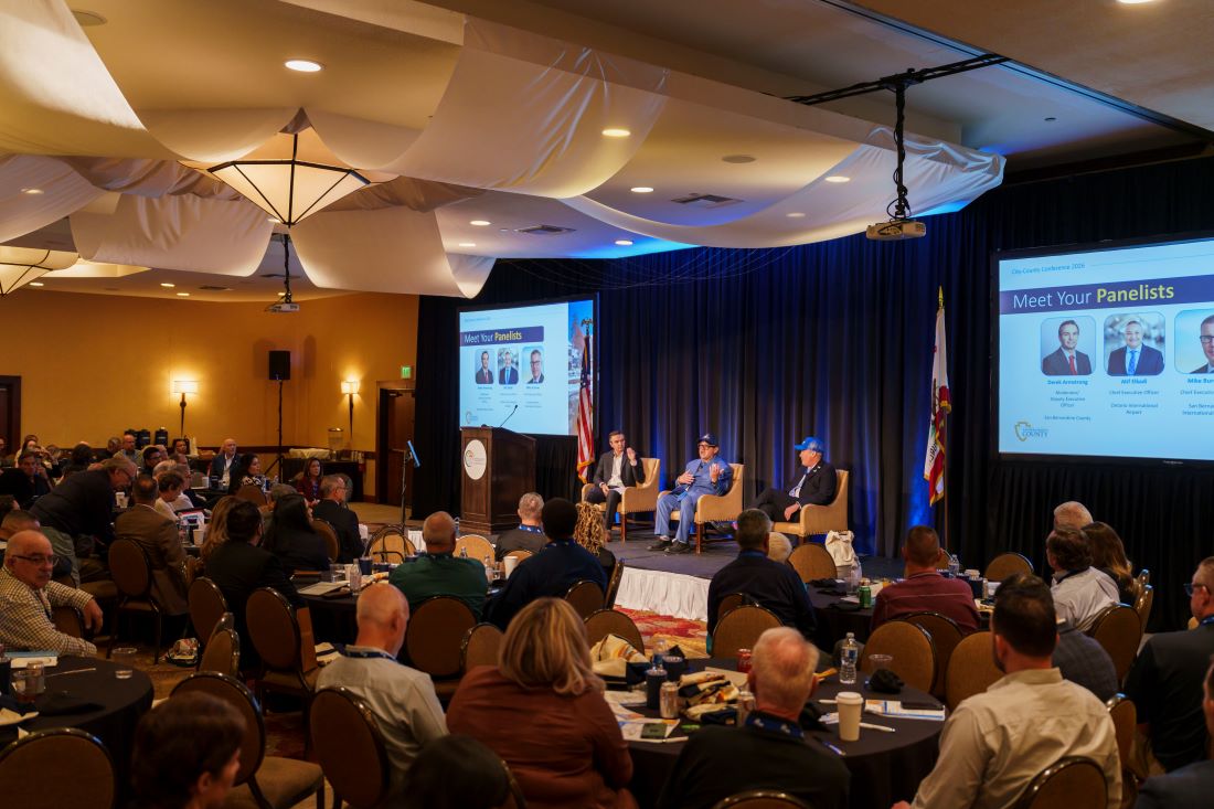 Conference attendees listen to a panel discussion during the 2026 City-County Conference.