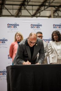 Supervisor Curt Hagman signs the Memorandum of Understanding during the West End Regional Navigation Center groundbreaking.
