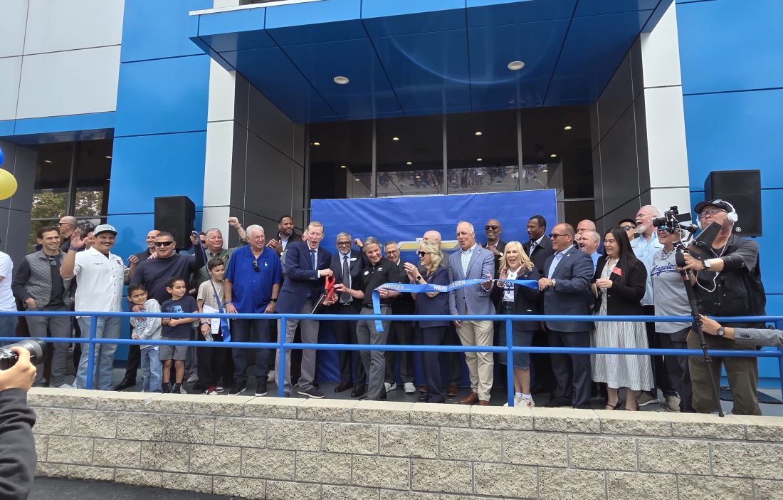 Community leaders, guests, and Orel Hershiser celebrate the dealership ribbon-cutting in Chino.