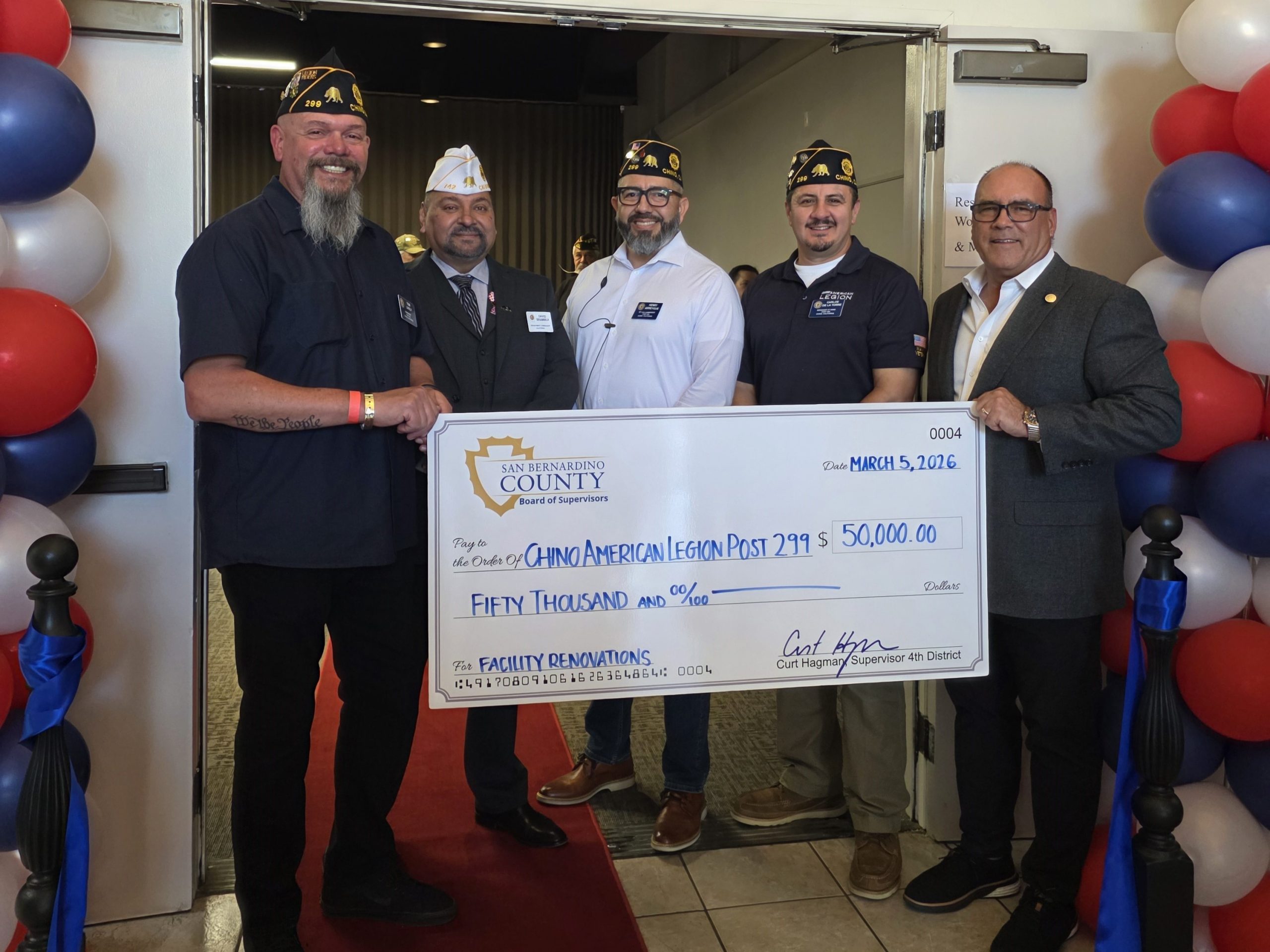 Supervisor Hagman presents a $50,000 check to the Chino American Legion Post 299.